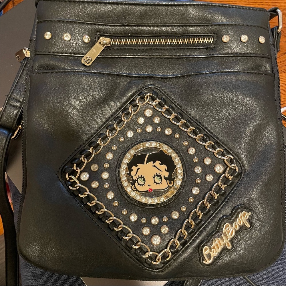 Betty Boop black leather crossbody purse with a rhinestone and chain design